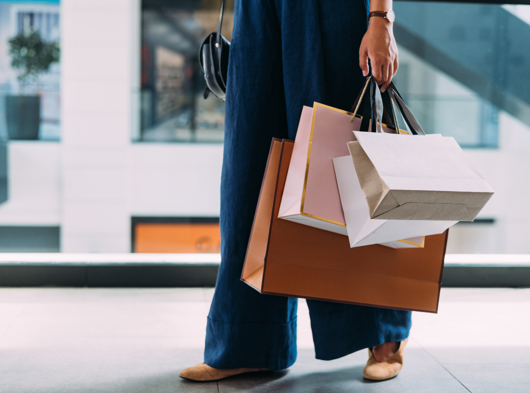 Woman holding selection of shopping bags